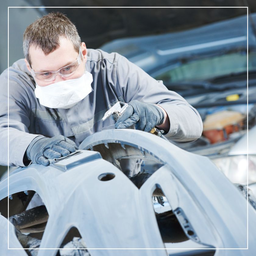 Detailer working on a car